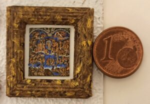 Confronto del dipinto microscopico con la moneta da un centesimo.